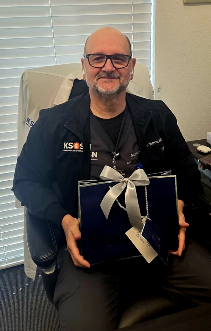 Doctor holding a gift