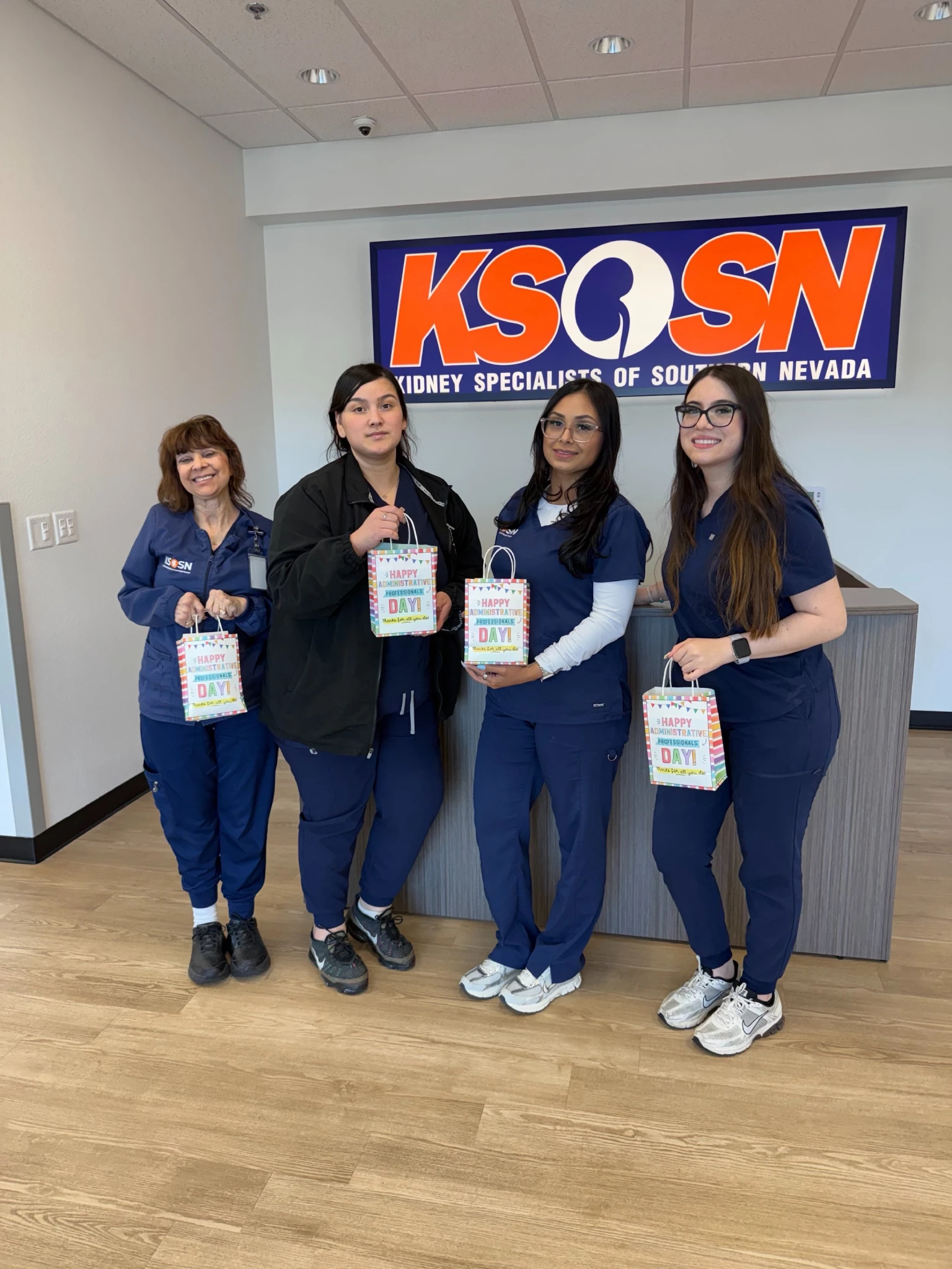 Nurses holding a gift